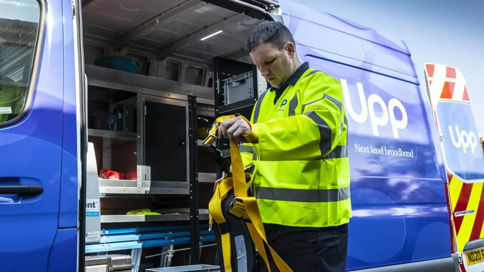 Fibre broadband engineer preparing equipment at a van